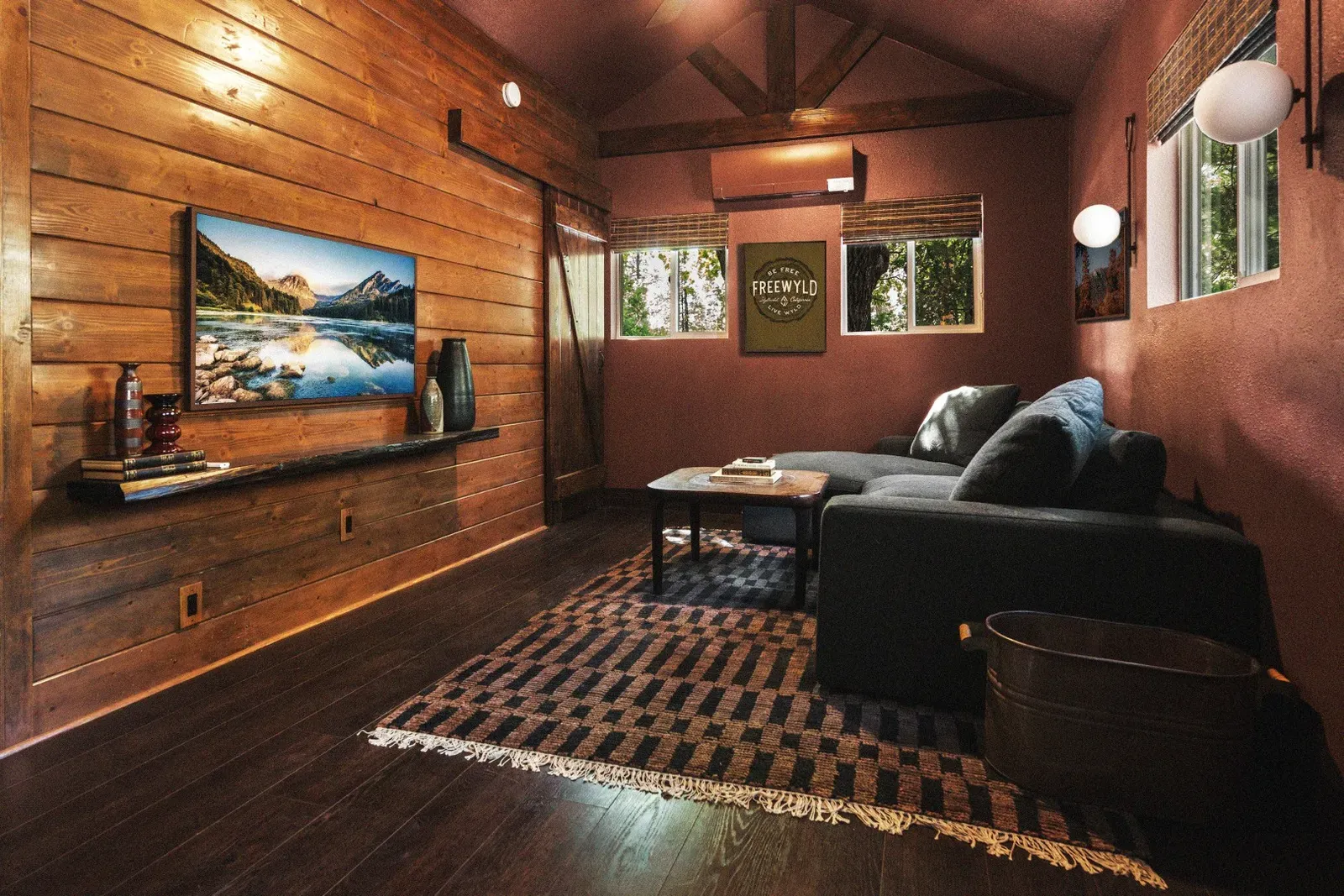 On the other side of the living area, sink into the comfortable couch and enjoy your favorite shows on the Frame smart TV.