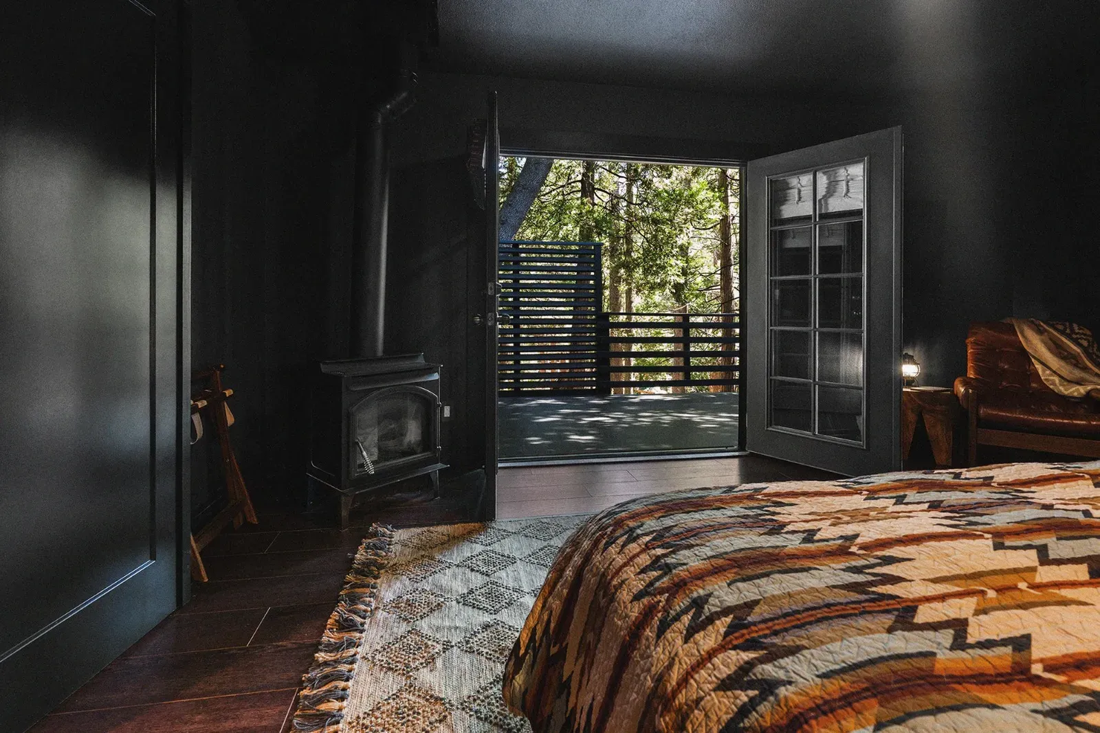 French doors from the master bedroom in Ursus lead out to a private deck. There is also a gas stove in this bedroom for chilly nights.
