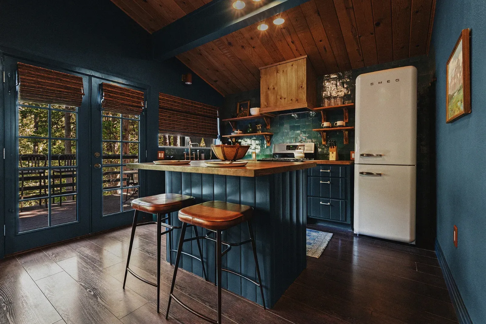 The kitchen is a stand-out feature with its trendy Smeg fridge and all the essentials you need to whip up meals in the cabin.