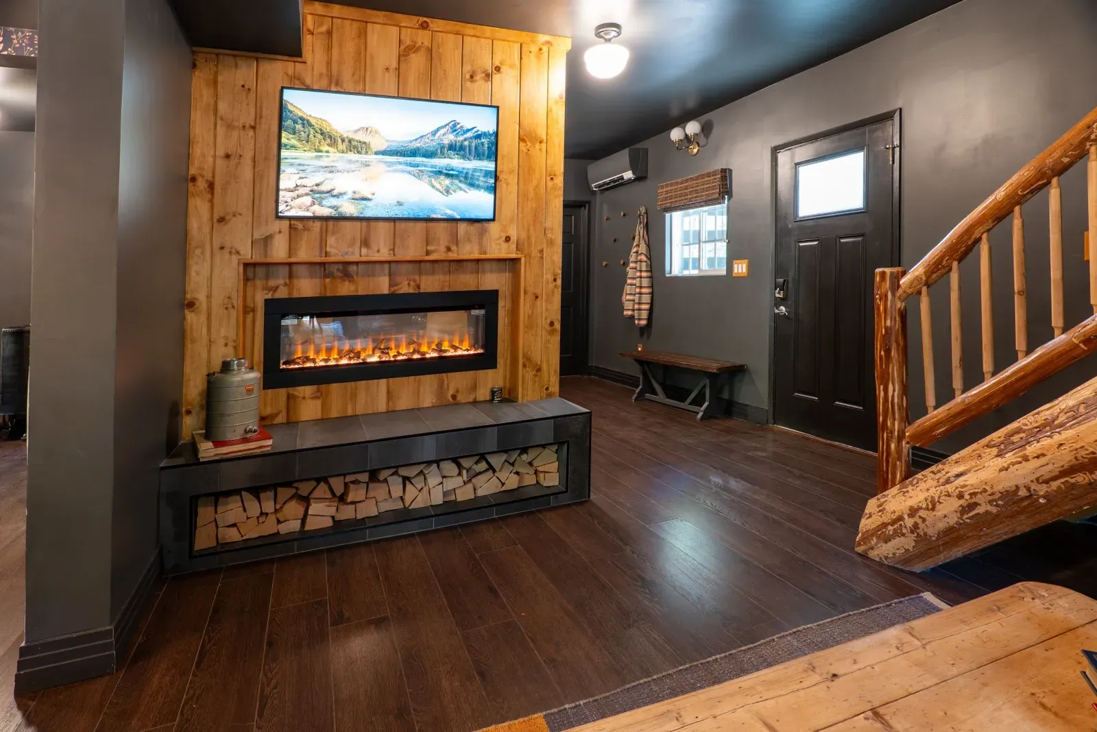 Cozy up in front of the living room fireplace to read a good book or to watch your favorite shows on the Frame smart TV.