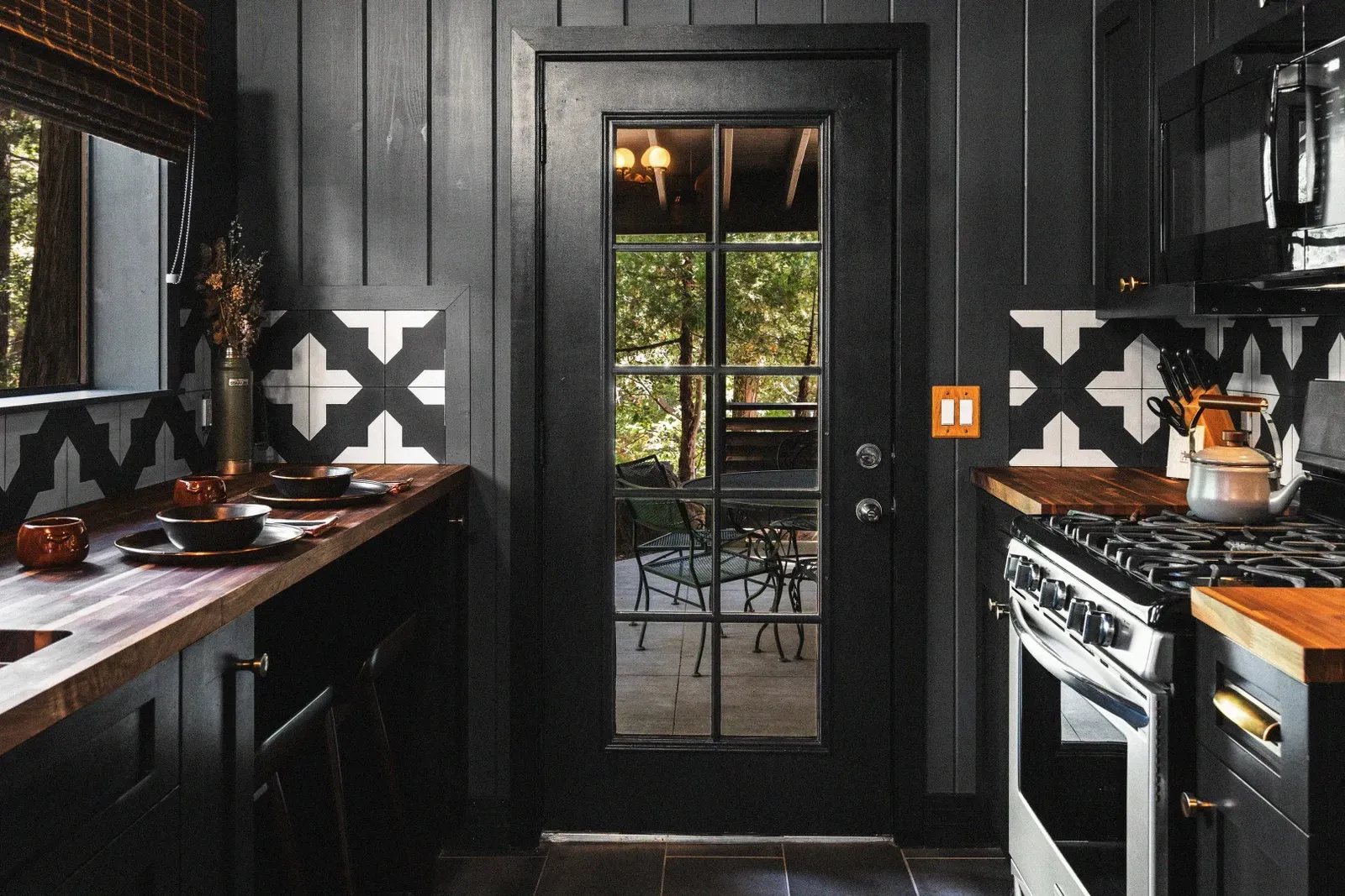 Through the kitchen door, you'll find a covered outdoor dining space to dine al fresco in the crisp mountain air.