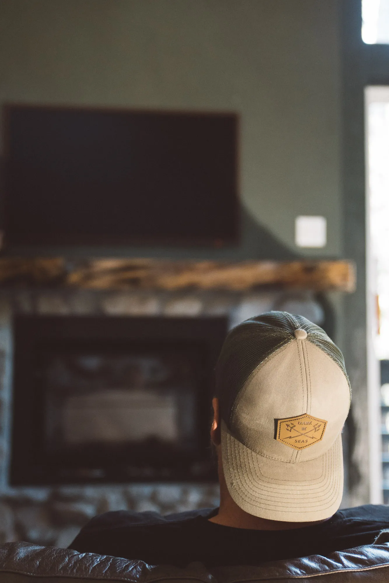 Man with backwards cap enjoying the cabin comforts of Freewyld in Idyllwild